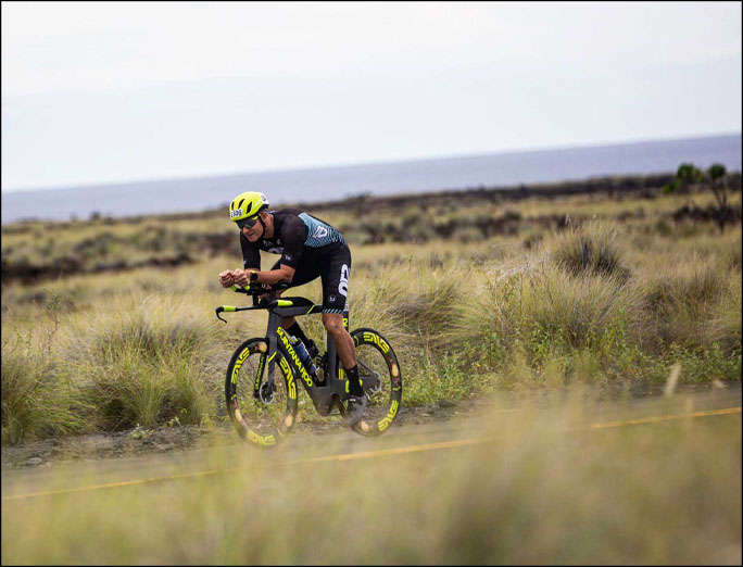 Podcast Telich Talks cover image of Greg Schaefer cycling on bike